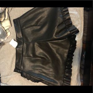 Black faux leather shorts